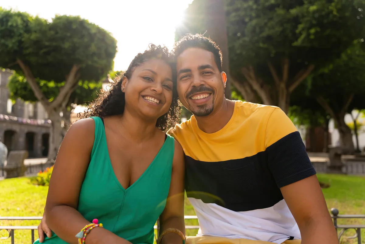 Couple sharing a warm outdoor moment, an editorial illustration for Latino HSV dating