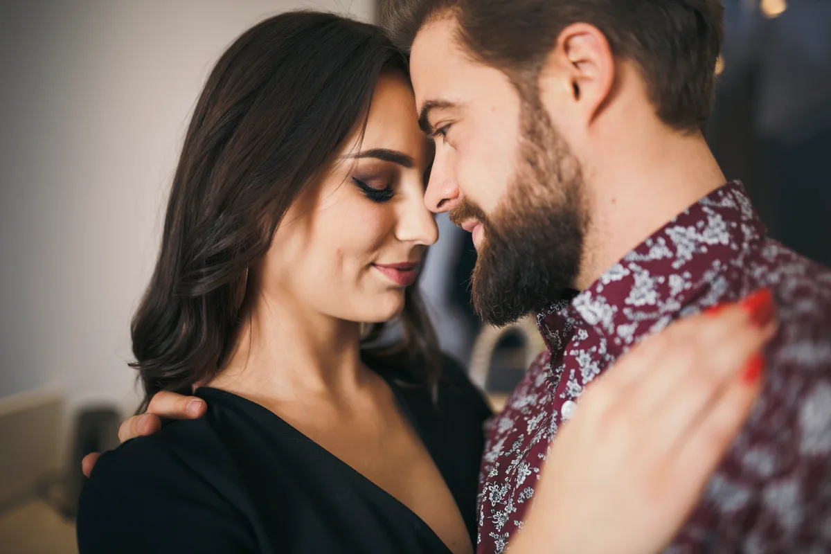 Adult couple close together illustrating private romantic connection for HSV dating professionals