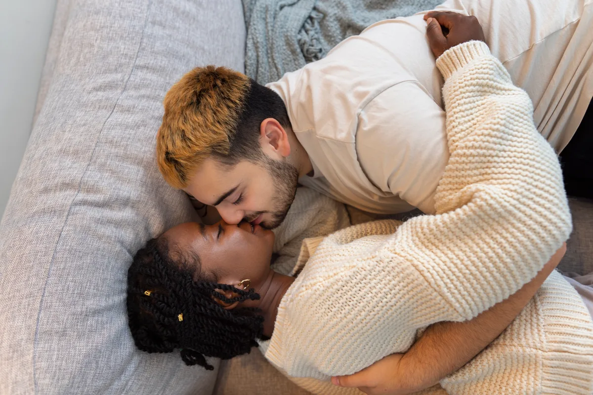 Adult couple sharing a close embrace, illustrating romantic partnership in HSV dating for single dads